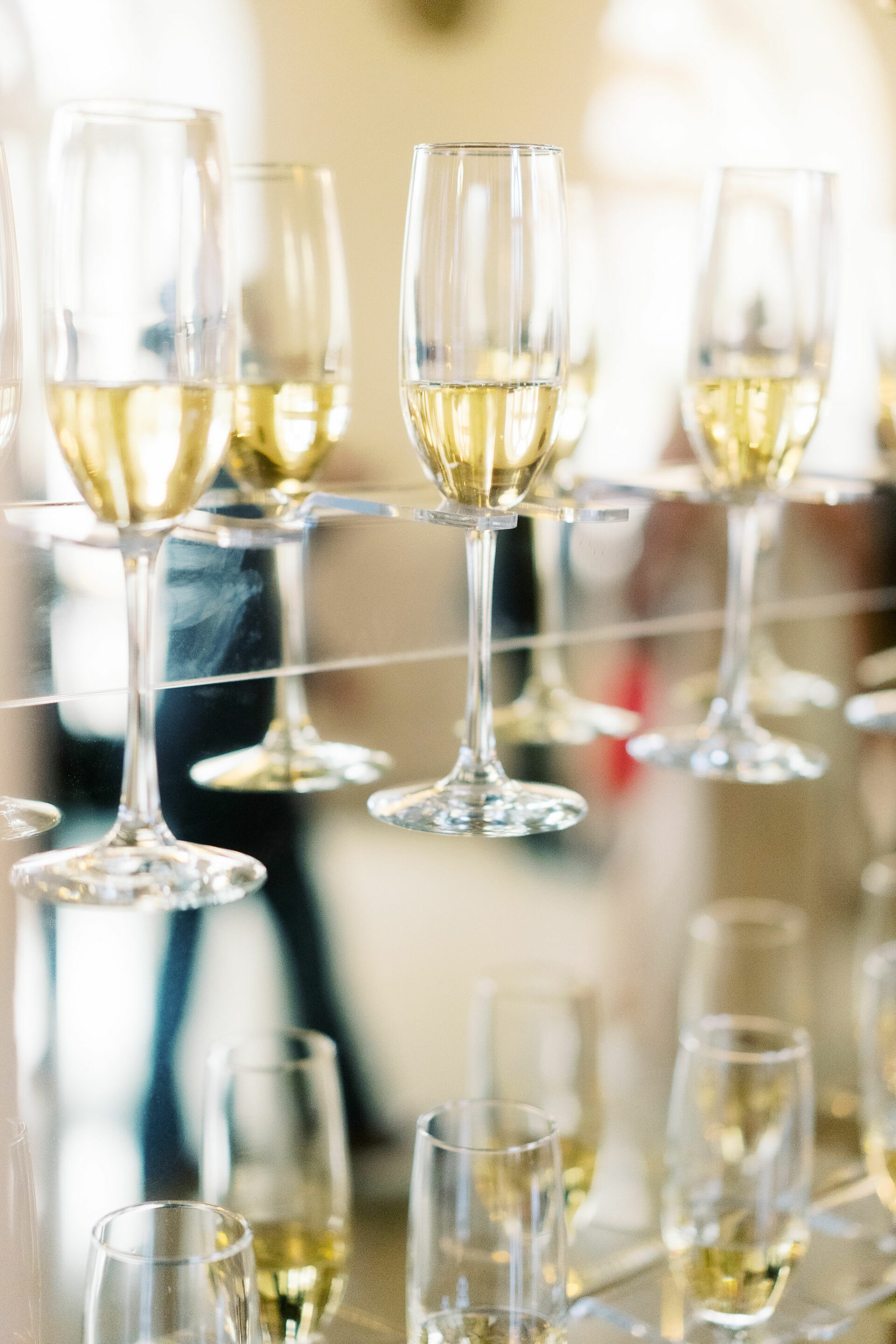 Champagne glasses in an elegant elevated holder
