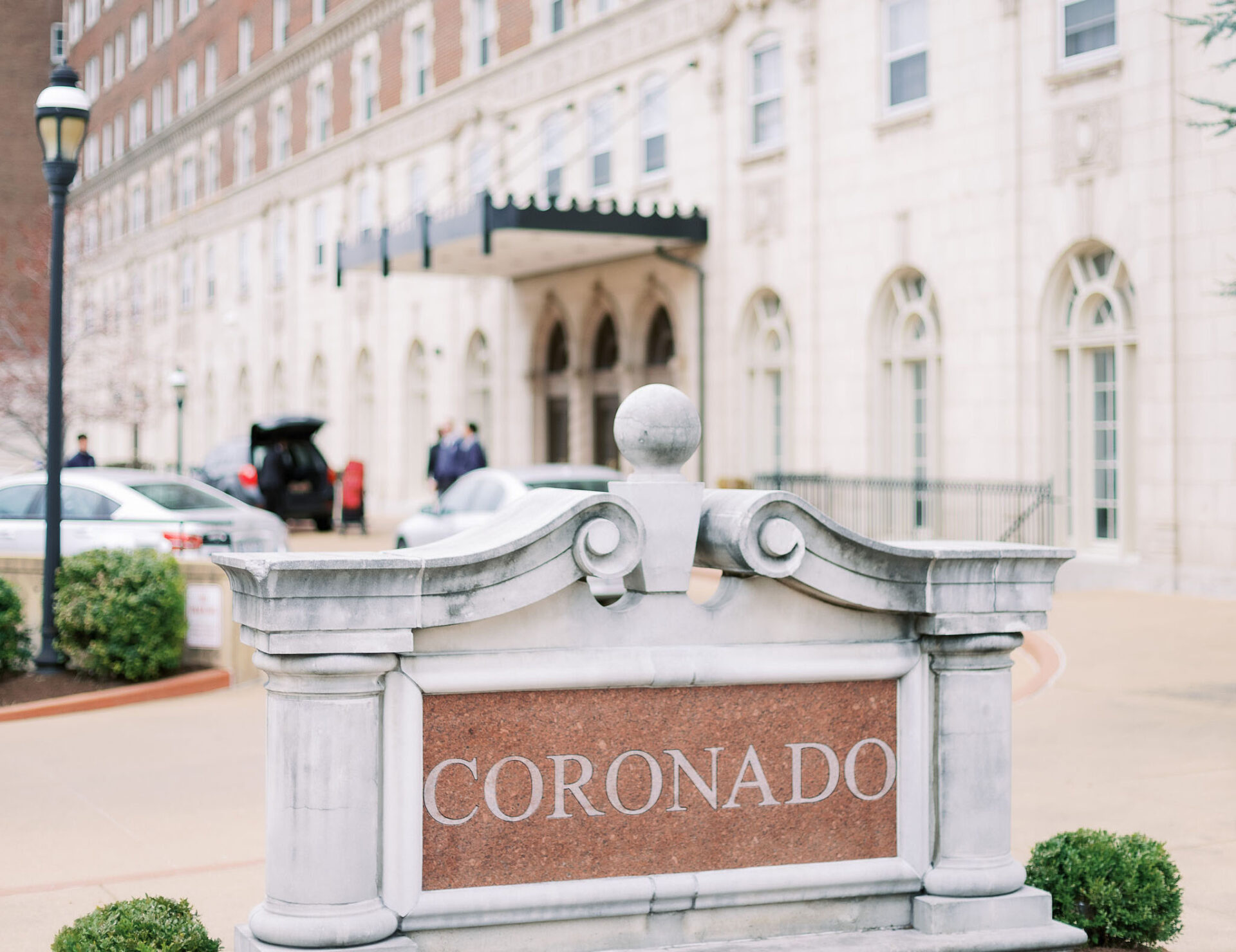 Etched stone sign that says "Coronado" in front of the Coronado venue